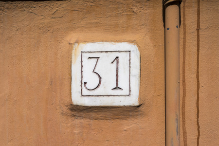 House number thirty one engraved in a marble plateの写真素材