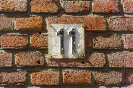 weathered house number eleven
