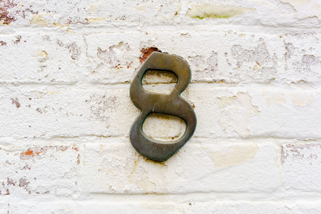 Bronze house number eight (8)の写真素材
