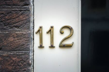 House number one hundred and twelve (112)の写真素材