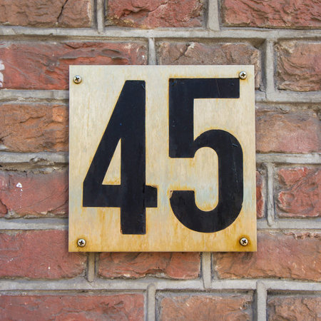 House number forty five on a metal plate.