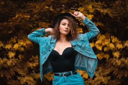 Outdoor fashion photo of young beautiful lady in autumnの写真素材
