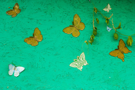 Green background with beautiful butterflies for your design.の写真素材