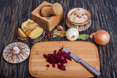 Russian vinaigrette ingredients: potatoes, beets, carrots, canned peas, pickled cabbage sunflower oil and dillの写真素材