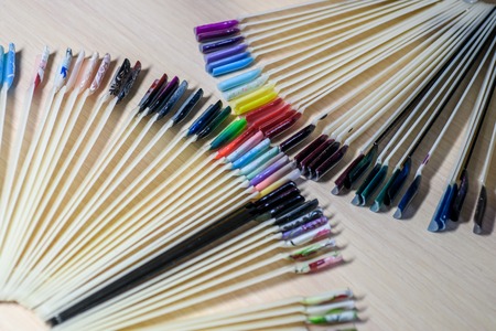 Samples of color nail polish. Nail polish testers in different colors on white wooden backgroundの写真素材