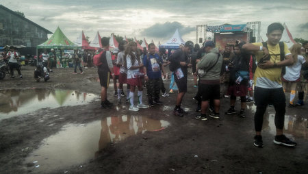 Mojokerto East Java Indonesia. Enthusiastic participants in unique costumes at the Mojokerto-Surabaya historic walk. On December 14 2024のeditorial素材