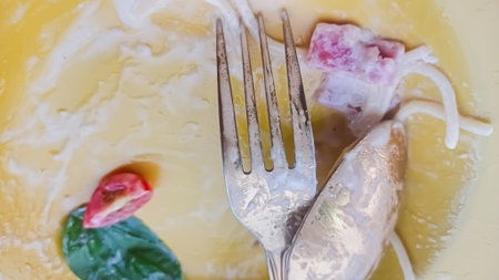 Top view of cuttlefish on a plate with fork and knifeの写真素材