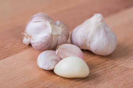 Fresh garlic on a wooden tableの写真素材