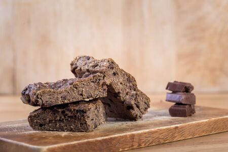 Oats brownies with measuring spoon on the wooden tableの写真素材