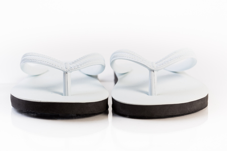 close-up rubber sandals isolated on whiteの写真素材