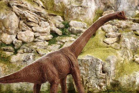 detailed miniature mountain model with dinosaurの写真素材