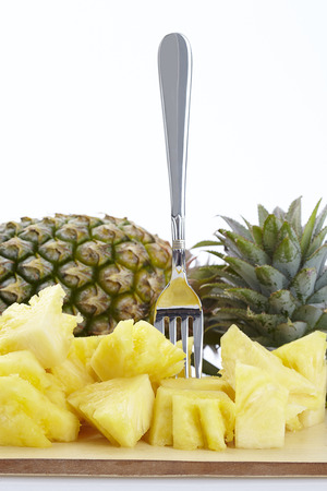 Juicy ripe sliced pineapple isolated on white backgroundの写真素材