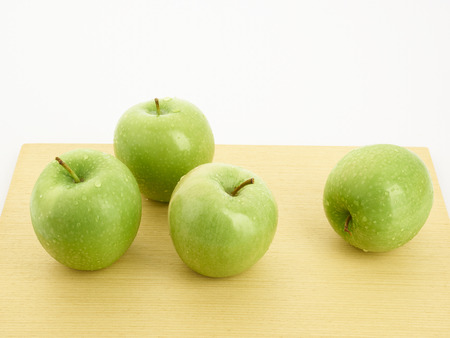 apples in a bowl on white  backgroundの写真素材