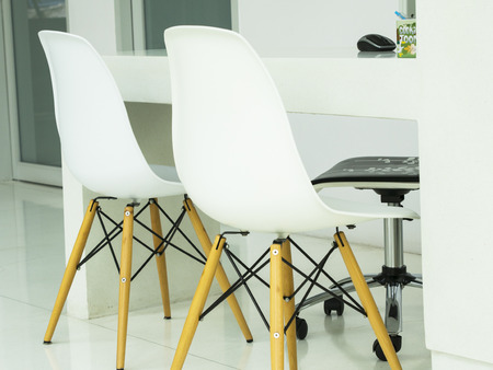 modern white chairs with table in officeの写真素材