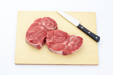 Fresh steak with spices on wooden backgroundの写真素材