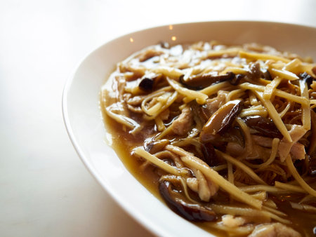 Stir fried yellow noodle with in a creamy gravy sauceの写真素材