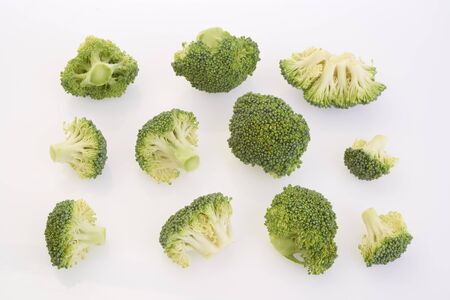 fresh green broccoli vegetables on white backgroundの写真素材
