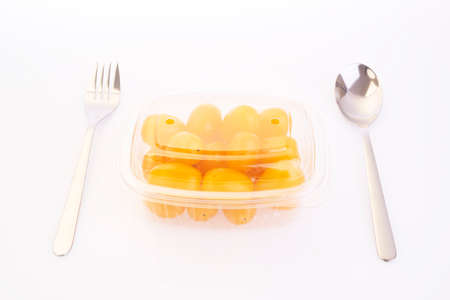 Shooting fresh Yellow tomatoes on white backgroundの写真素材