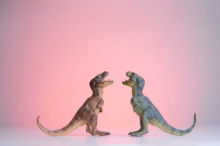 shooting dinosaur and monster model on red backgroundの写真素材