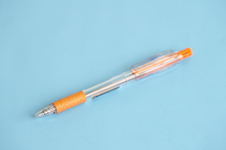 shooting different kinds of pens isolated on blue backgroundの写真素材