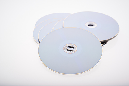 a group of blue-ray disk on white backgroundの写真素材