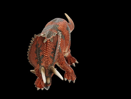 Isolated dinosaur in black backgroundの写真素材