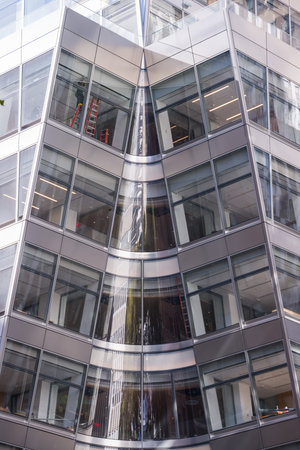 photo of New York building with fire escape ladders, USA.の写真素材