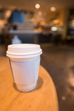Paper coffee cup in coffee shop.の写真素材