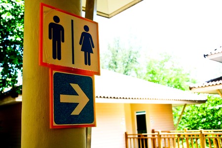 toilet sign with an arrowの写真素材