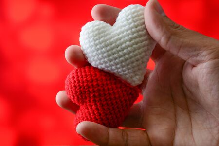 Pick red and white heart with beautiful red backgroundの写真素材