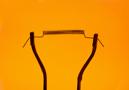 Closeup for yellow incandescent lighted bulbの写真素材