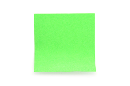 Green paper stick note with shadow on white backgroundの写真素材