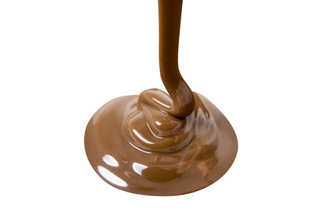 Melted hot chocolate is pouring. Isolated on white with clipping pathの写真素材