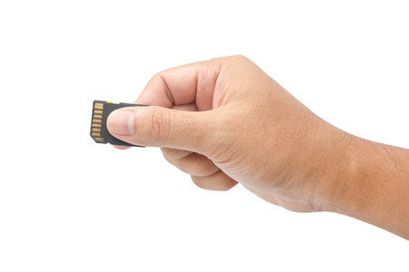 Hand with sd card isolated on white background with clipping path