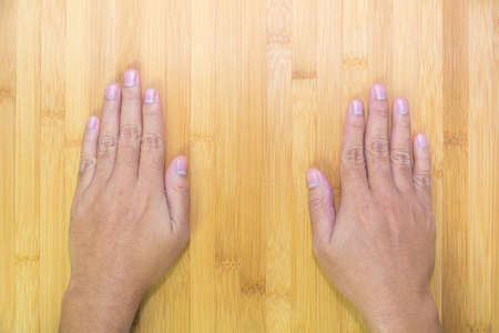 Top view for back hand on tableの写真素材