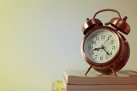 alarm clock and booksの写真素材