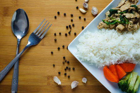 Rice with Fried Pork and Garlic Pepper on tableの写真素材