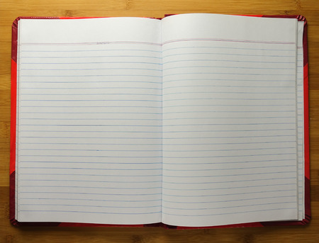 Open book with blank pages on wooden backgroundの写真素材