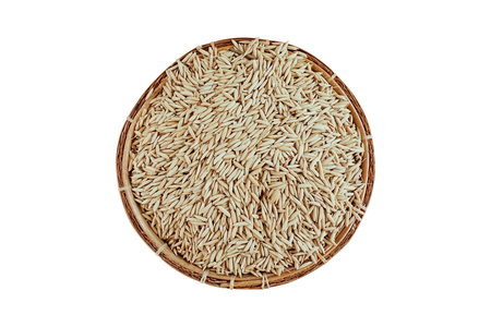 paddy rice in bamboo basket isolated on white background with clipping path - top viewの写真素材
