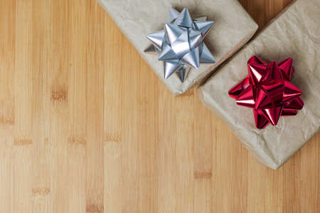 brown paper gift box on wooden background - top viewの写真素材