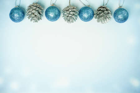 Winter background - Cyan christmas ball and pine coneの写真素材