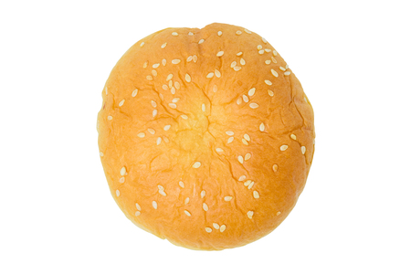 Burger bun with white sesame seeds isolated on a white backgroundの写真素材