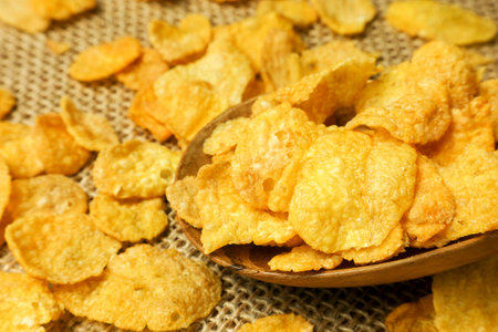 spoon with corn flakes, close-up