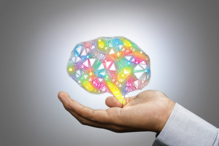 Colorful brain in man hand. Creative concept.