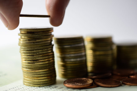 Saving money concept preset by hand putting money coin stack growing businessの写真素材