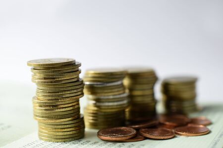 Close up of coins to stack of coins, Business Growth concept. Financial risk.の写真素材