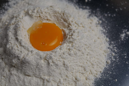 egg yolk on flourの写真素材