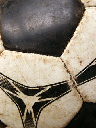 Old dirty soccer ball detail close-up. Macroの写真素材