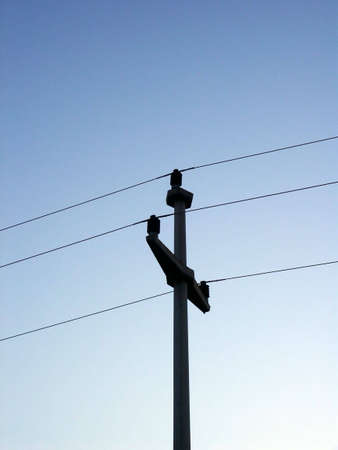 Electric pillar over sky background in eveningの写真素材