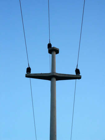 Electric pillar over sky background in eveningの写真素材